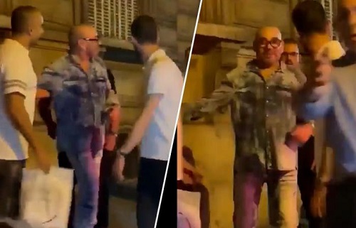 Le roi du Maroc errant à Paris avec un verre dans la main